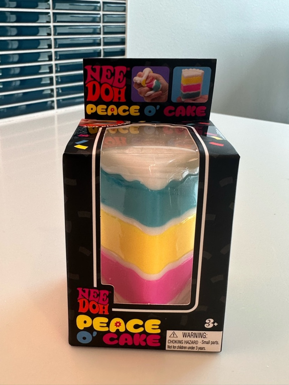 NEW IN BOX, SEALED NeeDoh Peace O' Cake Squishy Toy - White, Blue, Yellow, Pink